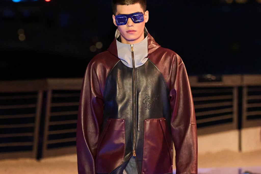 model man in brown leather coat and sunglasses