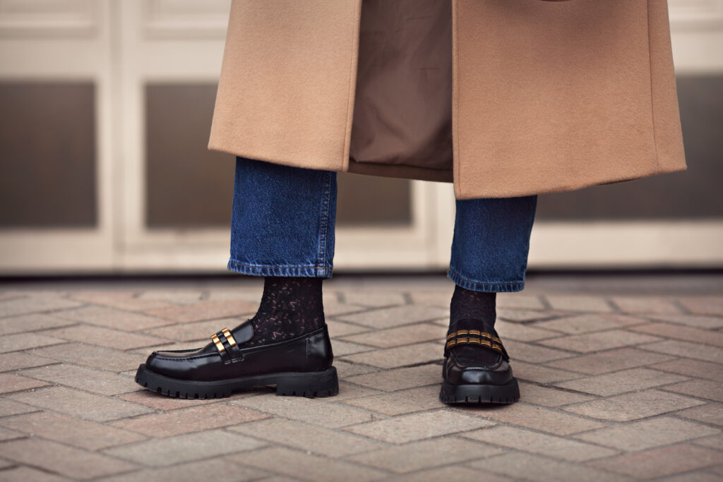 woman in jeans and shoes